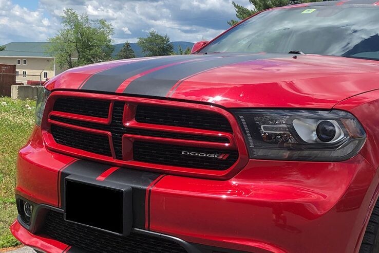 racing stripes on red dodge car